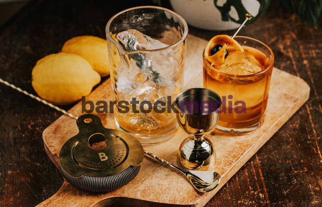 Old Fashioned With Bar Tools on Wood Table