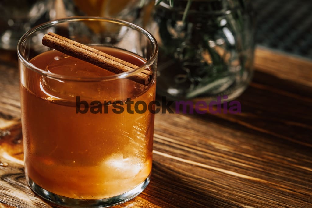 Cinnamon Fall Old Fashioned On Wood Bar Photo