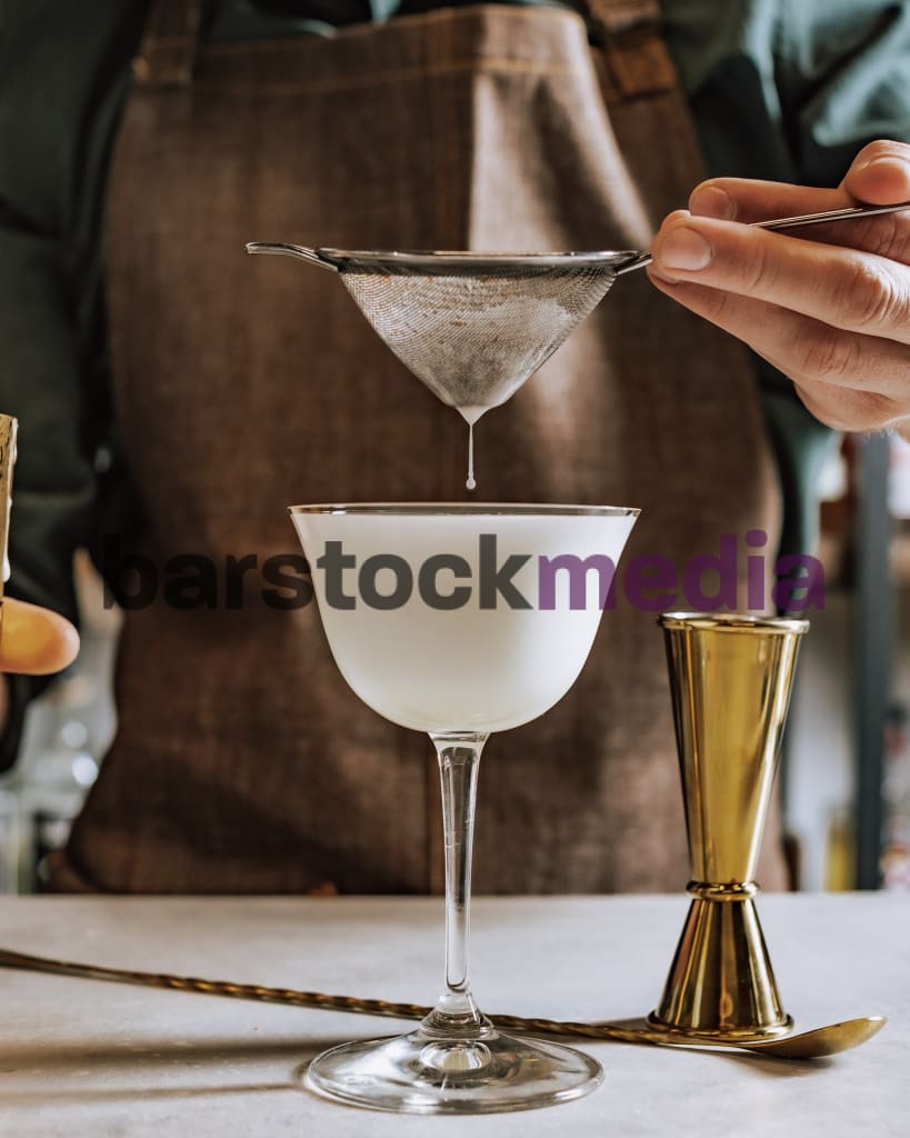 Egg White Sour Drip With Bar Tools Around Photo