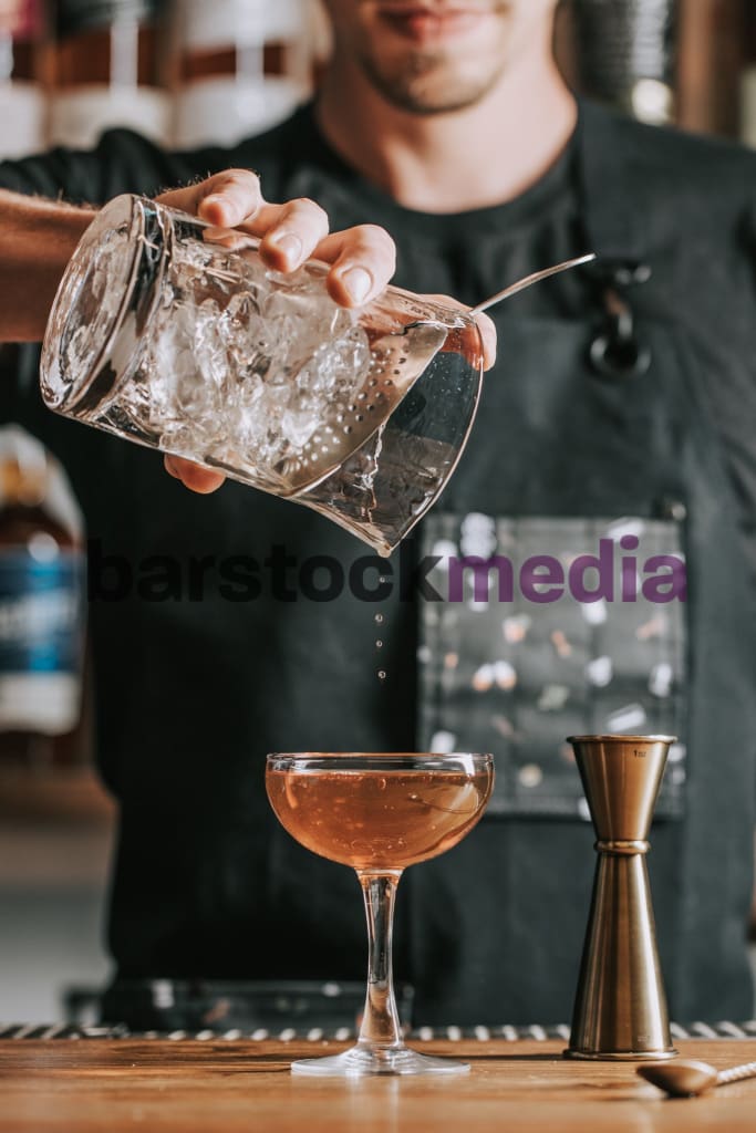 Bartender Stirred Pour Into Coupe Photo